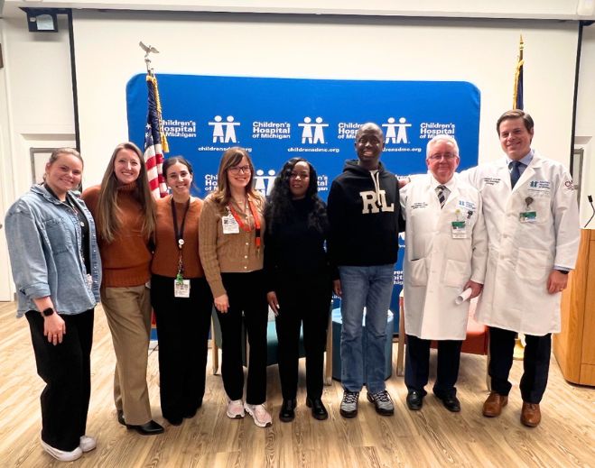Hospital staff and patient group photo