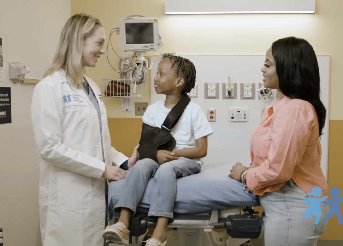 Doctor with young patient and mother