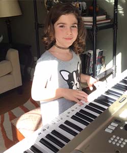 Anna playing electric keyboard